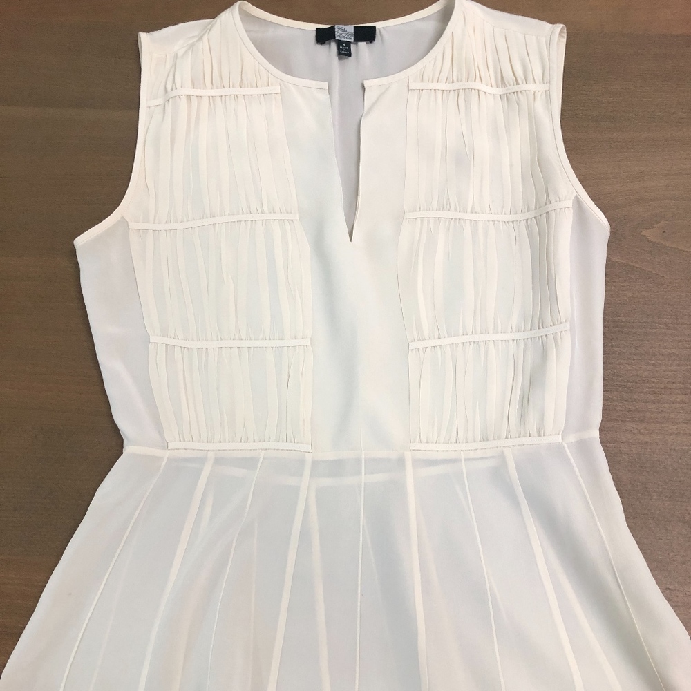Cream peplum Saks Fifth Avenue silk blouse, size 4